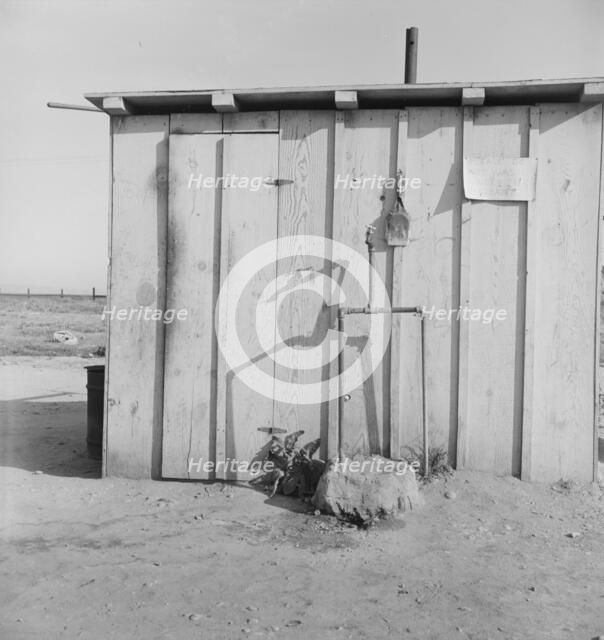 Water supply for ten cabins in Arkansawyers auto camp. Greenfield, Salinas Valley, California, 1939. Creator: Dorothea Lange.