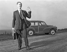 Waving Sales rep with a Moris Minor Shooting Brake, 3rd Aug 1963. Creator: Michael Walters