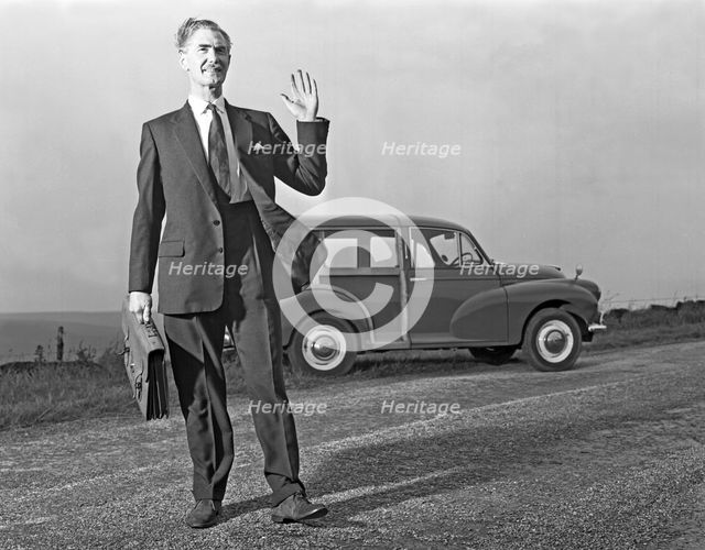 Waving Sales rep with a Moris Minor Shooting Brake, 3rd Aug 1963. Creator: Michael Walters.