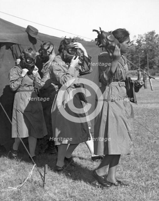 WACS emerging after gas chamber training, Fort Sheridan, Illinois, USA, 1964. Artist: SP5 Wigley