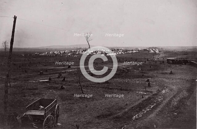 [Wagon in a landscape with army encampment in the distance]. Brady album, p. 125, 1861-65. Creator: Unknown.