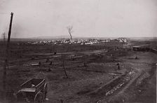 [Wagon in a landscape with army encampment in the distance]. Brady album, p. 125, 1861-65. Creator: Unknown