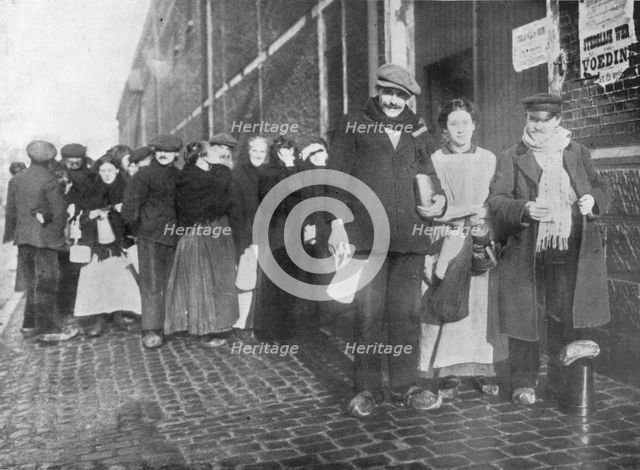 'Waiting for relief rations at Bruges', 1915. Artist: Unknown.