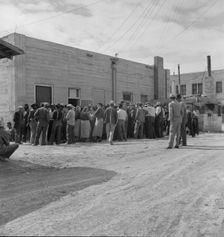 Waiting for the relief checks at Calipatria, California, 1937. Creator: Dorothea Lange