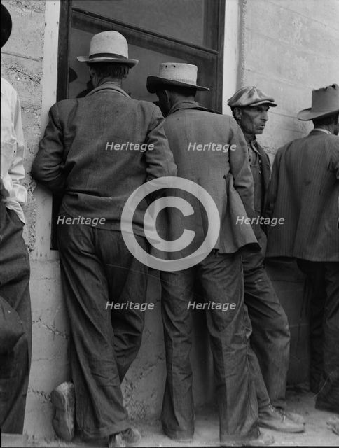 Waiting for the relief checks at Calipatria, California, 1937. Creator: Dorothea Lange.
