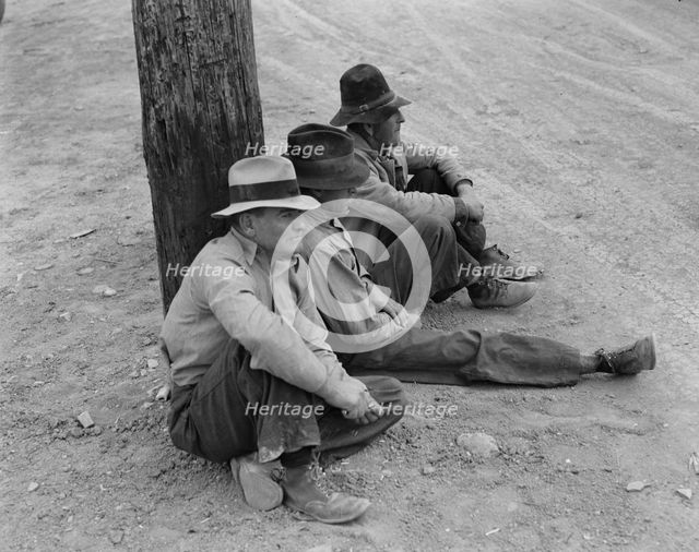 Waiting for the semi-monthly relief checks at Calipatria, California, 1937. Creator: Dorothea Lange.