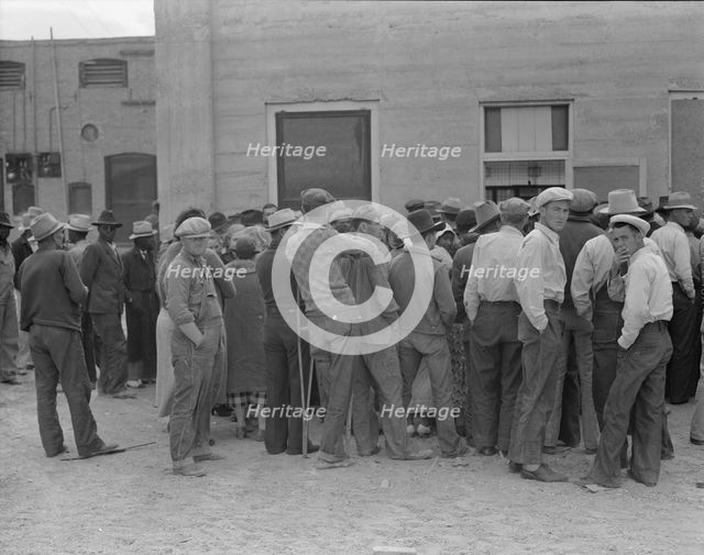 Waiting for the semi-monthly relief checks at Calipatria, California, 1937. Creator: Dorothea Lange.