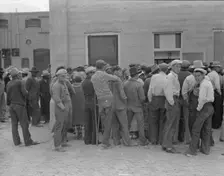 Waiting for the semi-monthly relief checks at Calipatria, California, 1937. Creator: Dorothea Lange
