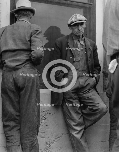 Waiting for the semimonthly relief checks at Calipatria, Imperial Valley, California, 1937. Creator: Dorothea Lange.