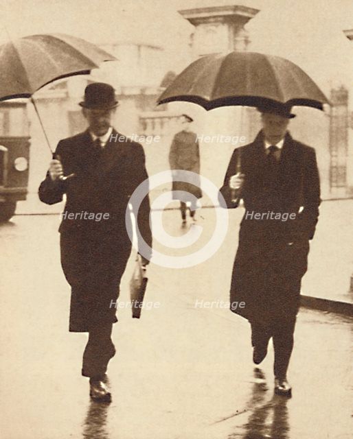 'Walking In The Rain', 1937. Artist: Unknown.
