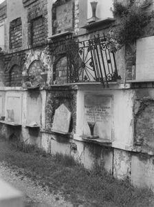 Wall tombs of the old St. Louis Cemetery, New Orleans, between 1920 and 1926. Creator: Arnold Genthe