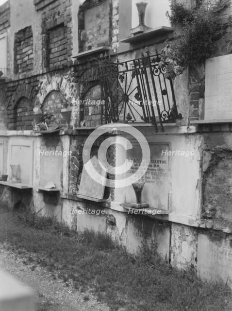 Wall tombs of the old St. Louis Cemetery, New Orleans, between 1920 and 1926. Creator: Arnold Genthe.