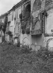 Wall tombs of the old St. Louis Cemetery, New Orleans, between 1920 and 1926. Creator: Arnold Genthe