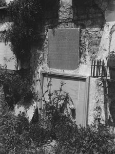 Wall tombs of the old St. Louis Cemetery, New Orleans, between 1920 and 1926. Creator: Arnold Genthe