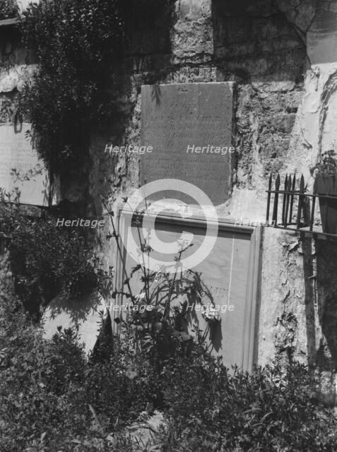 Wall tombs of the old St. Louis Cemetery, New Orleans, between 1920 and 1926. Creator: Arnold Genthe.