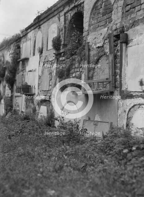 Wall tombs of the old St. Louis Cemetery, New Orleans, between 1920 and 1926. Creator: Arnold Genthe.