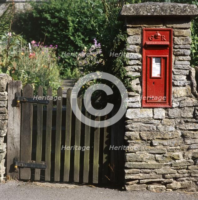 Wall-mounted post box and wooden gate, Upper Slaughter, Cotswolds, Gloucestershire, c2000s(?). Artist: Unknown.