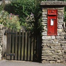 Wall-mounted post box and wooden gate, Upper Slaughter, Cotswolds, Gloucestershire, c2000s(?)