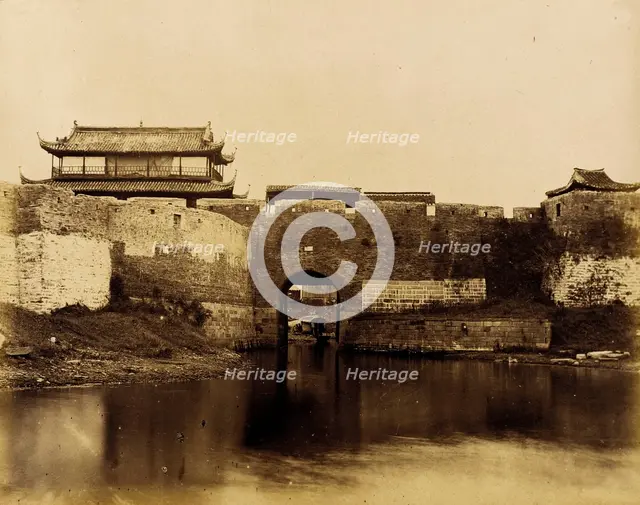 Walled River and Bridge with Buildings Above, 1860. Creator: Felice Beato.