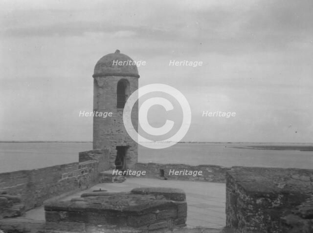 Walls and round tower by the water, Castillo de San Marcos, St. Augustine, Florida, c1920-c1926. Creator: Arnold Genthe.