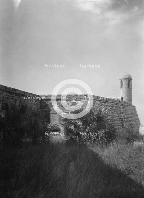 Walls and round tower by the water, Castillo de San Marcos, St. Augustine, Florida, c1920-c1926. Creator: Arnold Genthe.
