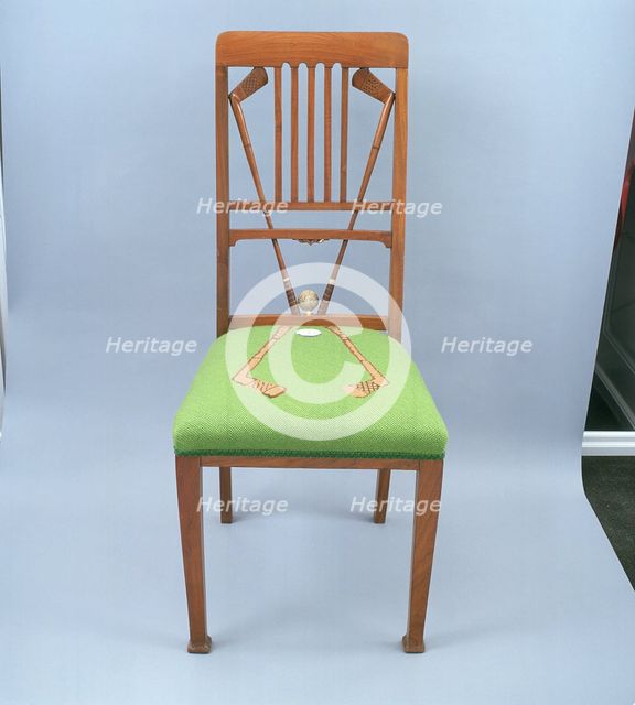 Walnut dining chair incorporating golf clubs and a golf ball, 1920s.  Creator: Unknown.