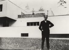 Walter Gropius in front of his home in Dessau, 1926-1927. Creator: Anon