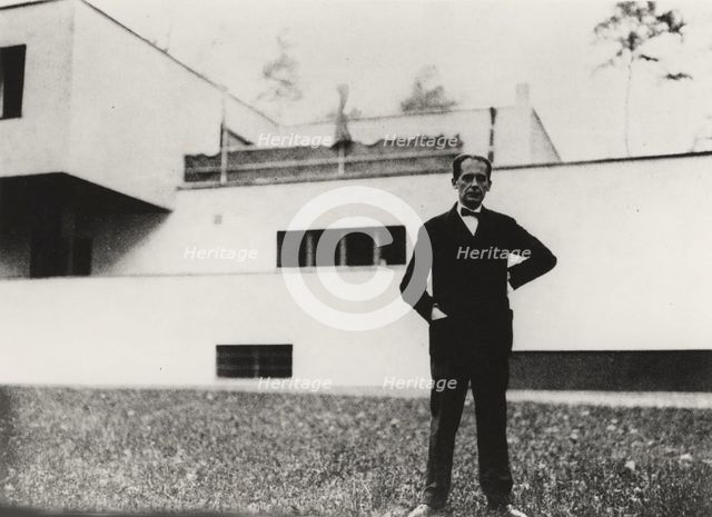 Walter Gropius in front of his home in Dessau, 1926-1927. Creator: Anon.