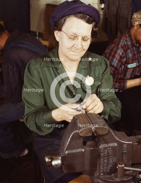 War production worker at the Vilter [Manufacturing] Company making M5...Milwaukee, Wis. , 1943. Creator: Howard Hollem.