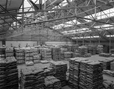 Warehouse at Spillers Animal Foods, Gainsborough, Lincolnshire, 1961. Creator: Michael Walters
