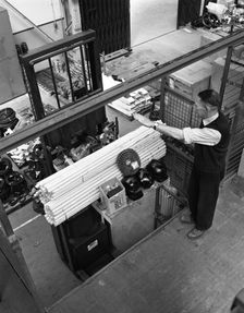 Warehouseman loading a fork lift truck in the stores, Bestwood Colliery, Nottinghamshire, 1962. Artist: Michael Walters