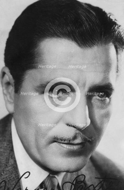 Warner Baxter, (1889-1951), American actor, c1930s-c1940s. Signed photograph. Artist: Unknown