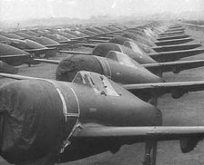 Warplanes Sitting in an Airfield With Covers Over the Propellers, 1943-1944. Creator: British Pathe Ltd