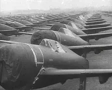 Warplanes Sitting in an Airfield With Covers Over the Propellers, 1943-1944. Creator: British Pathe Ltd