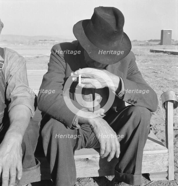 Was Nebraska farmer, now migrant farm worker in the West, Merrill, Klamath County, Oregon, 1939. Creator: Dorothea Lange.
