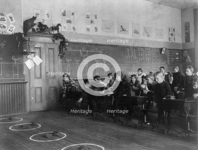 Washington, D.C. public schools - 3rd Division children tossing bean bags in ring, (1899?). Creator: Frances Benjamin Johnston.