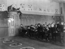 Washington, D.C. public schools - 3rd Division children tossing bean bags in ring, (1899?). Creator: Frances Benjamin Johnston