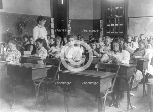 Washington, D.C. public schools, 1st Div. - class making geometric forms with paper, (1899?). Creator: Frances Benjamin Johnston.