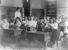 Washington, D.C. public schools, 1st Div. - class making geometric forms with paper, (1899?). Creator: Frances Benjamin Johnston