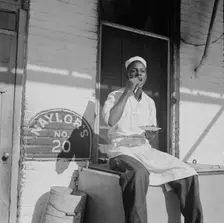 Washington, DC. A dishwasher who works in a waterfront restaurant, Washington, D.C., 1942. Creator: Gordon Parks