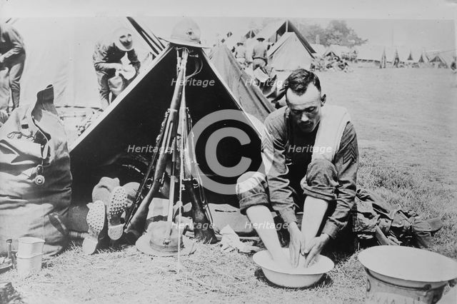 Washing tired feet, 1918. Creator: Bain News Service.