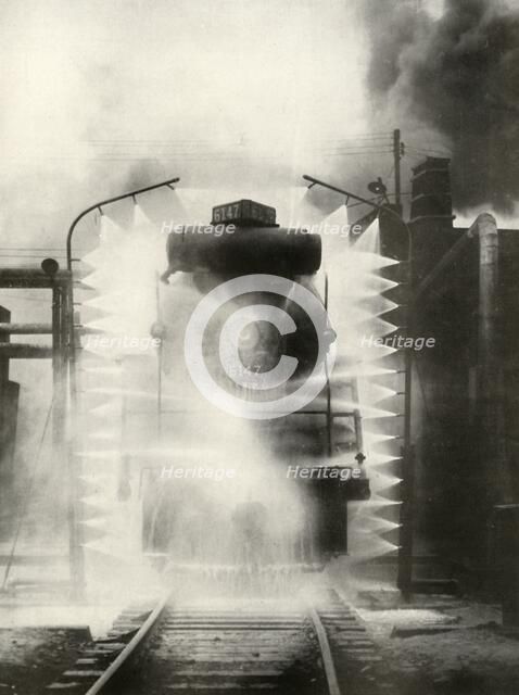 'Washing A Locomotive on the Canadian National Railway, at Montrea', 1935. Creator: Unknown.