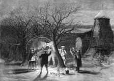 Wassailing apple trees with hot cider in Devonshire on twelfth eve, 1861