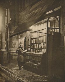 Wet Winter Evening and a Book Lover in Bloomsbury c1935. Creator: Fincham