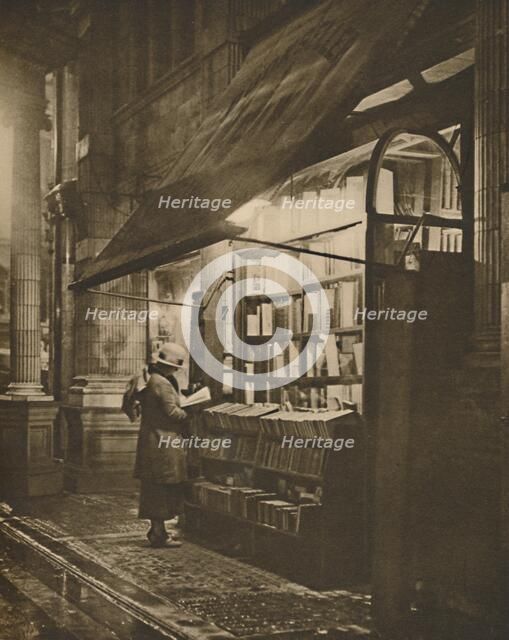 'Wet Winter Evening and a Book Lover in Bloomsbury', c1935. Creator: Fincham.