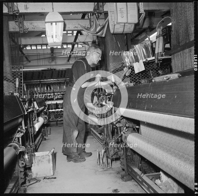 Weaver operating a Jacquard power loom, 1966-1974. Creator: Eileen Deste.