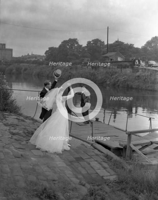 Wedding couple crossing the river Don, Mexborough, South Yorkshire, 1961.  Artist: Michael Walters