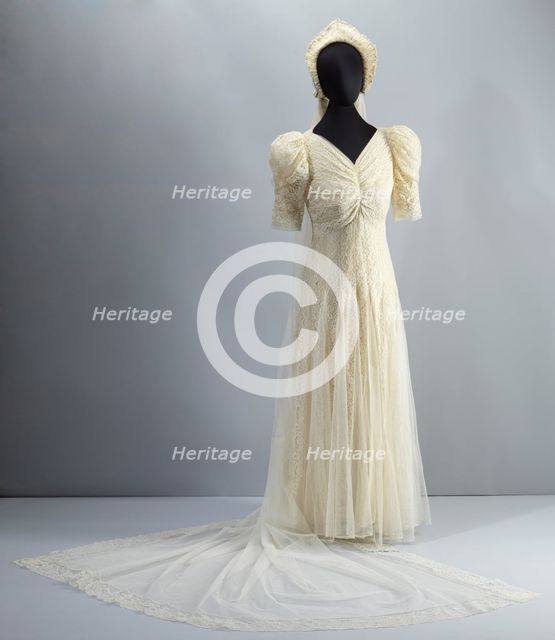 Wedding dress worn by Lollaretta Pemberton with veil and headpiece, 1939. Creator: Unknown.