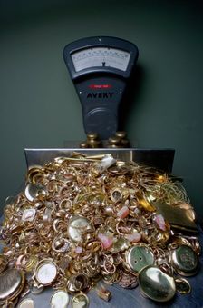 Weighing gold scrap, Hatton Garden, London. Creator: Tony Evans
