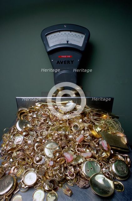 Weighing gold scrap, Hatton Garden, London.  Creator: Tony Evans.